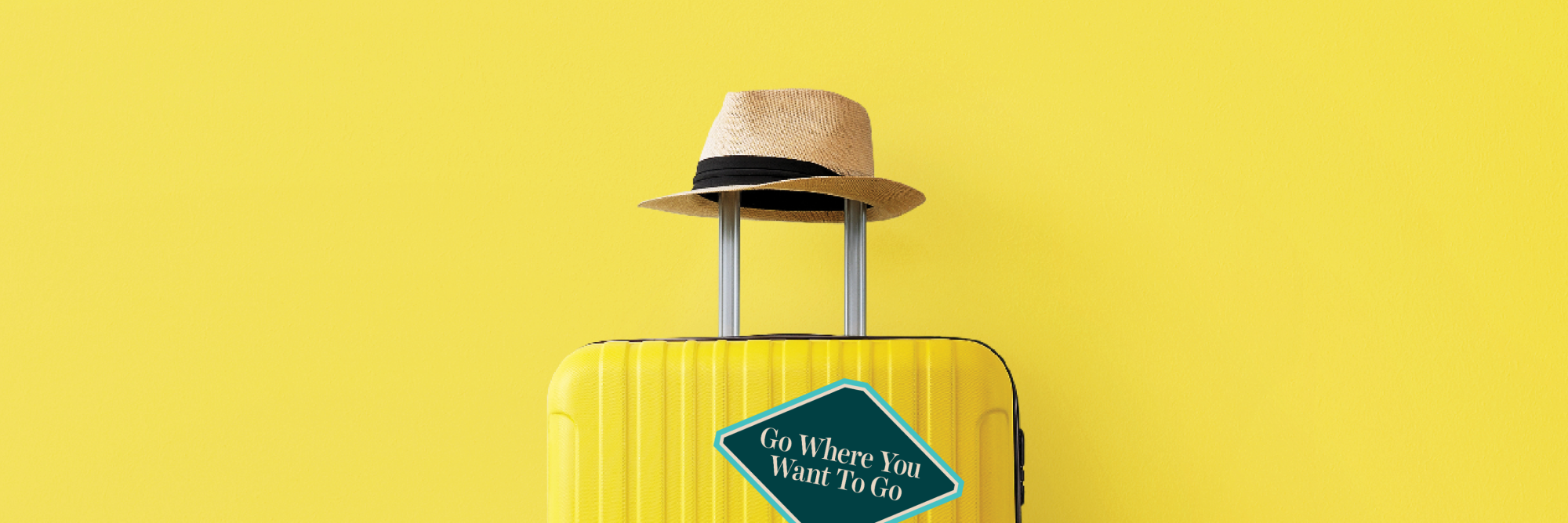 Hat resting on yellow suitcase handle against a yellow background